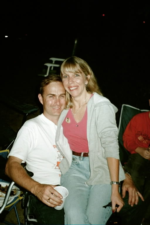 Rich and Susie share a dessert by the campfire