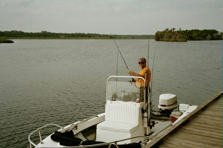 Bo does an equipment check on Boat Zaza docked on Tomoka River