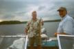 Mick displays a 25-inch Northern Pike caught on a gold spinner bait just minutes before a rain storm.